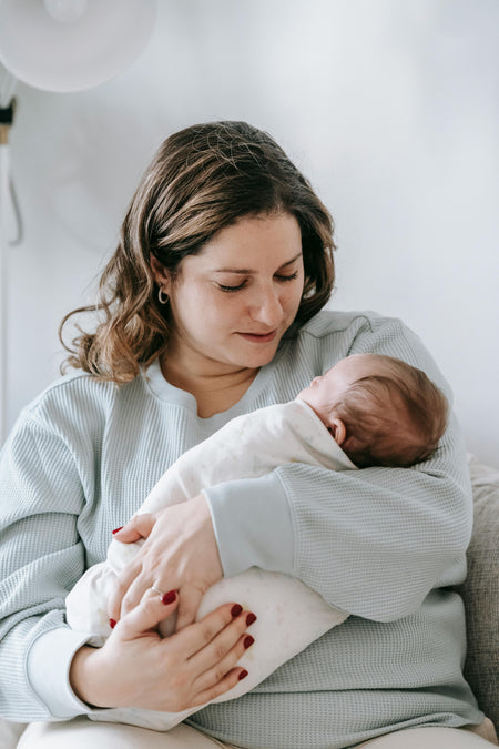 postpartum mother with baby