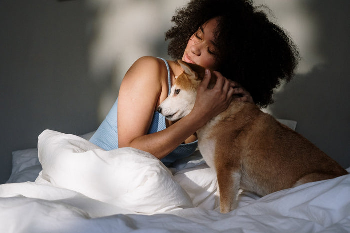 Woman hugging her beautiful pet dog