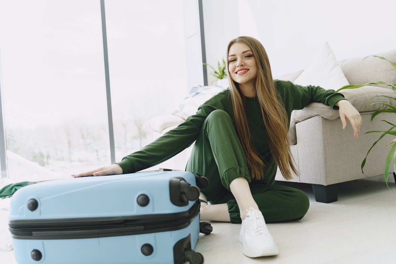 Happy woman preparing for a travel