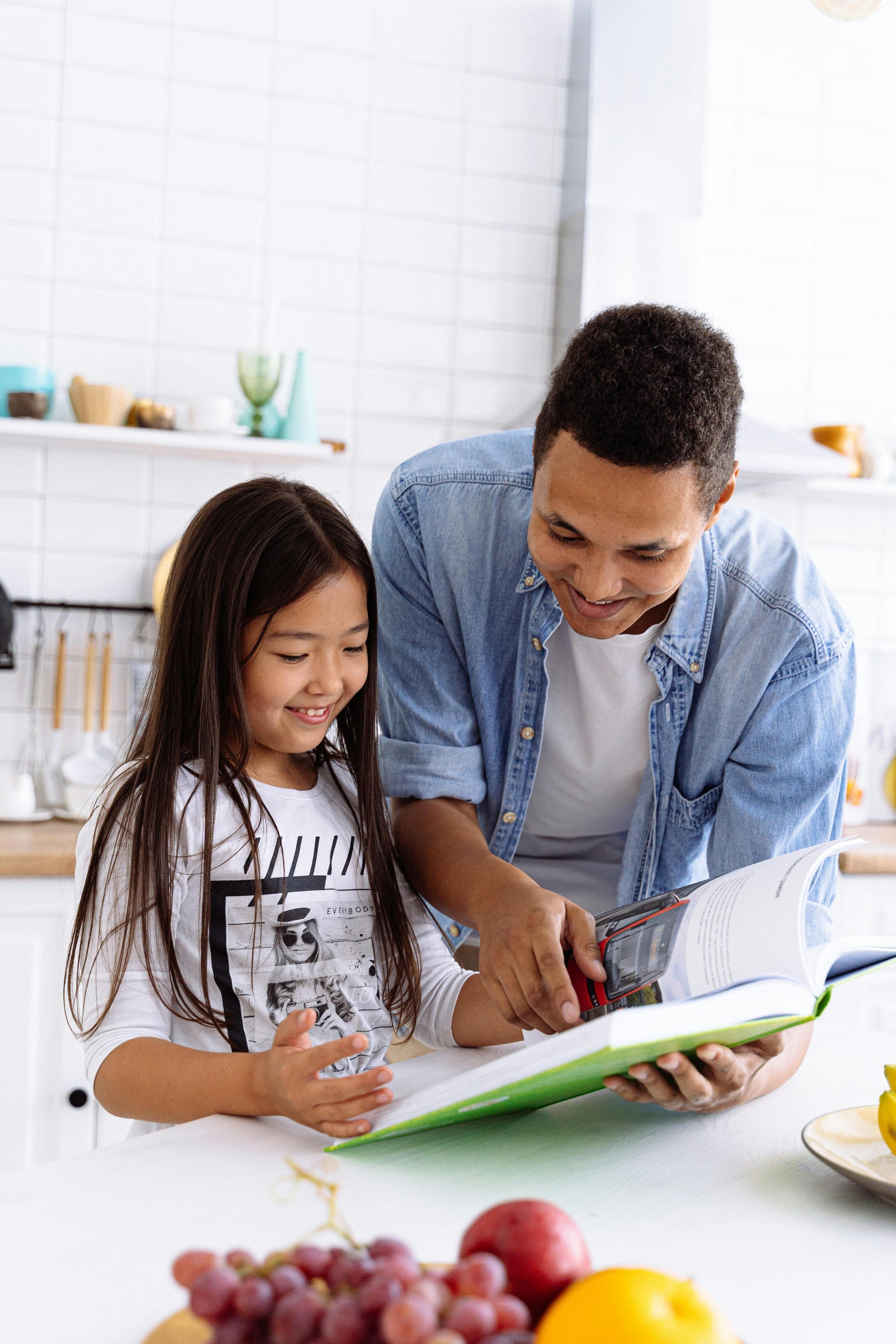 Father reading to daughter